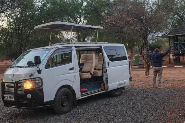 ELMAG SAFARIS pop-top safari van outside a Kenyan safari lodge